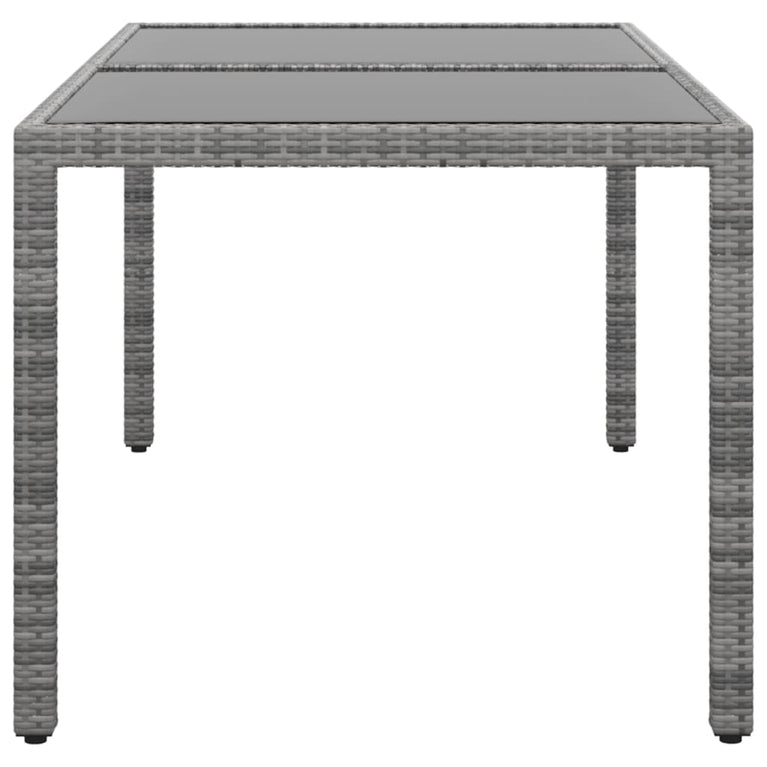 Tuintafel 150x90x75 cm gehard glas en poly rattan grijs