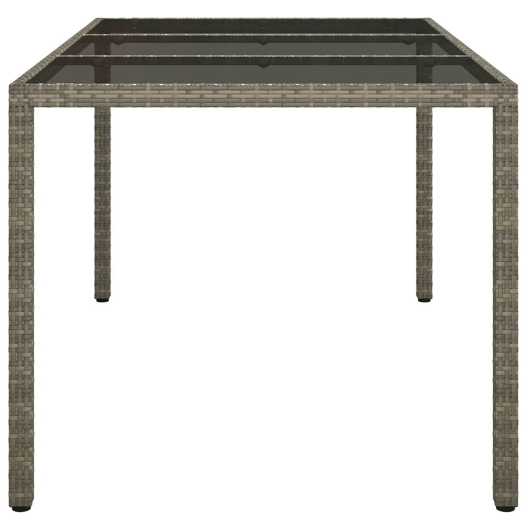 Tuintafel 150x90x75 cm gehard glas en poly rattan grijs MeubelReus