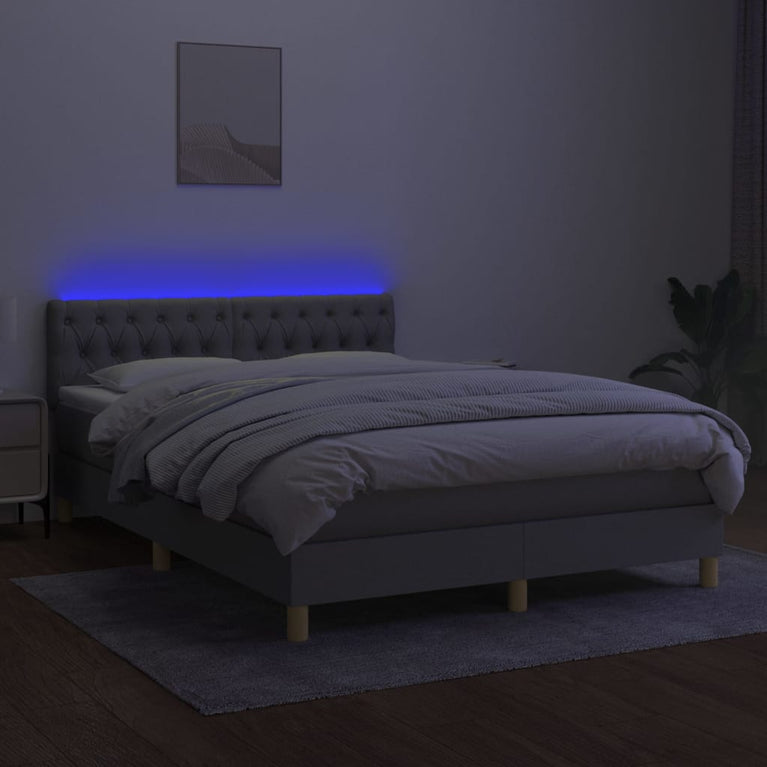 Boxspring met matras en LED stof lichtgrijs 140x190 cm