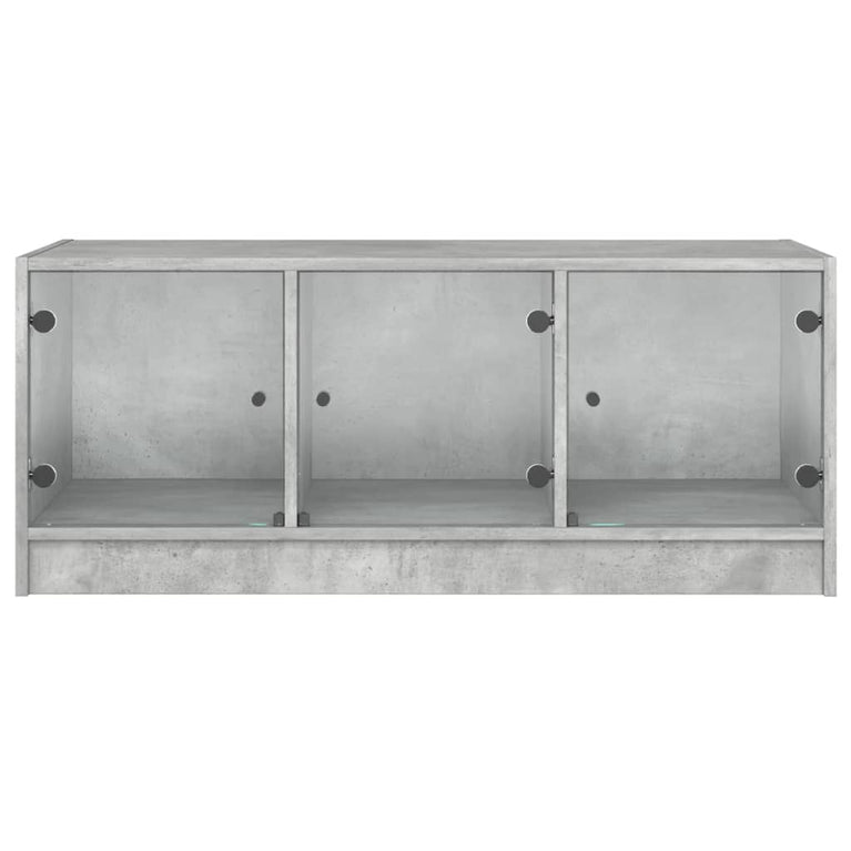 Salontafel met glazen deuren 102x50x42 cm betongrijs