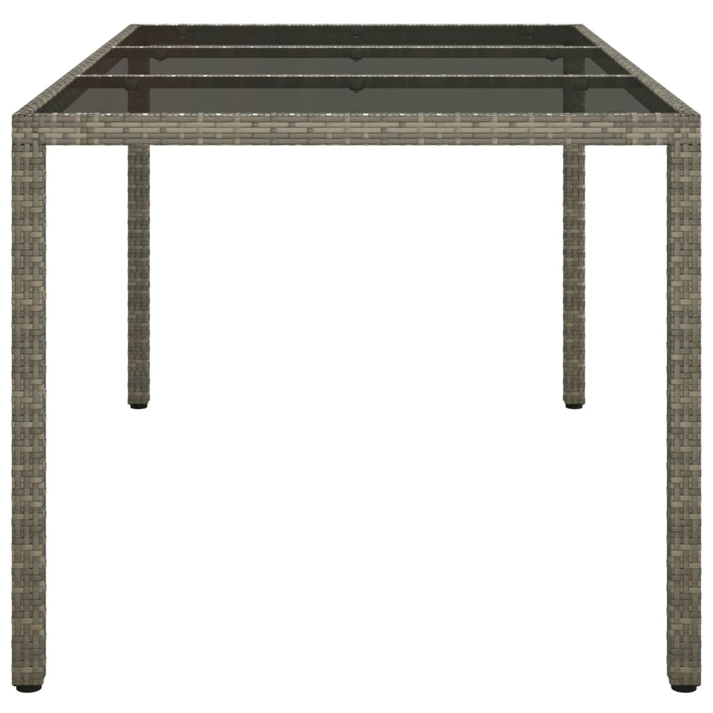Tuintafel 150x90x75 cm gehard glas en poly rattan grijs MeubelReus