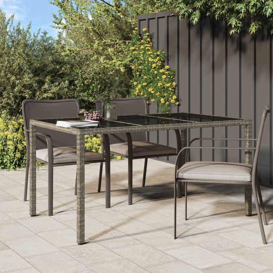 Tuintafel 150x90x75 cm gehard glas en poly rattan grijs MeubelReus