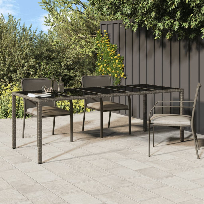Tuintafel 250x100x75 cm gehard glas en poly rattan grijs MeubelReus