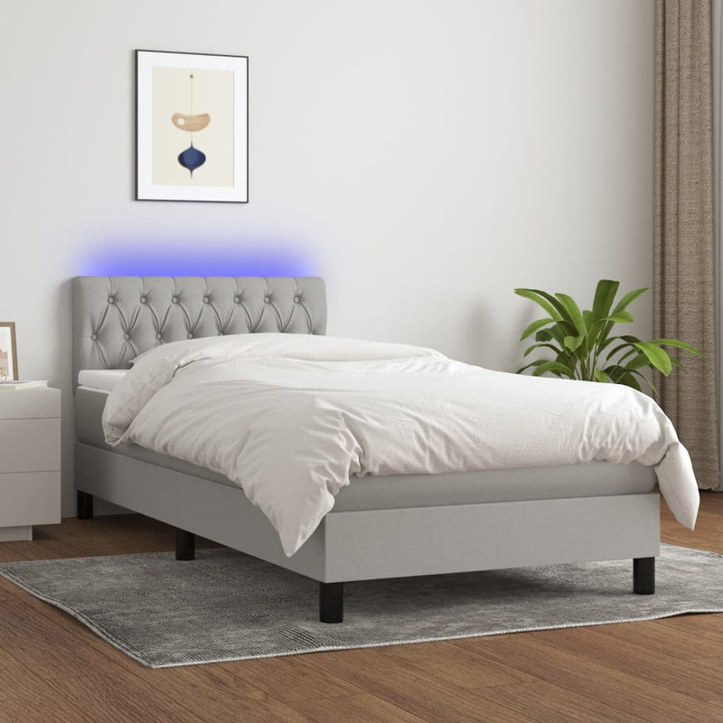 Boxspring met matras en LED stof lichtgrijs 90x200 cm