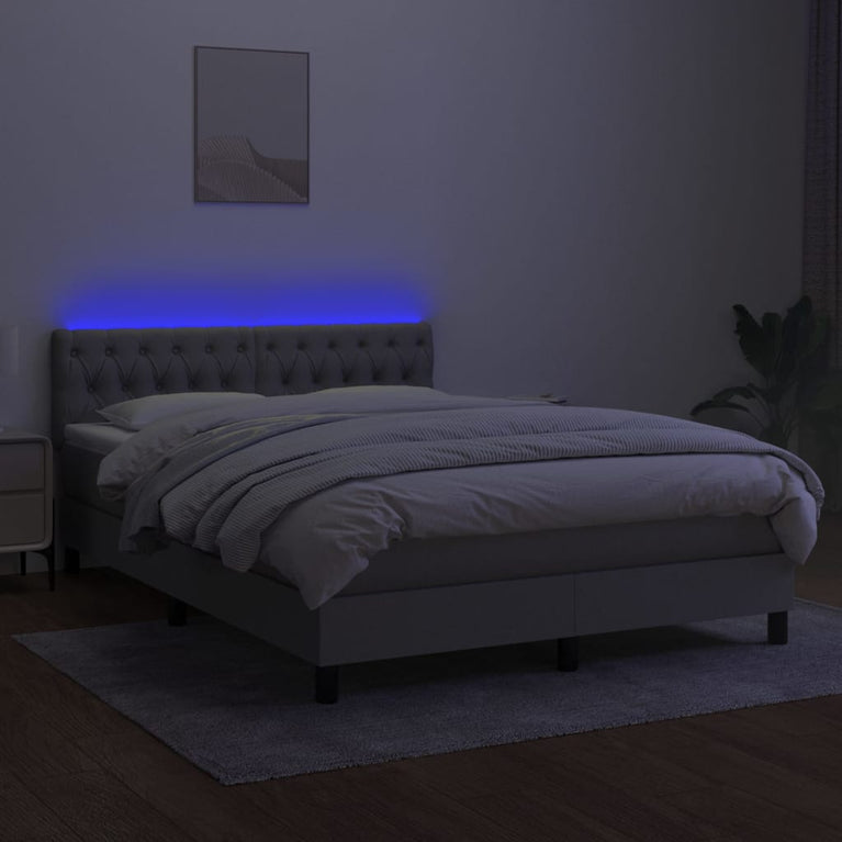 Boxspring met matras en LED stof lichtgrijs 140x200 cm